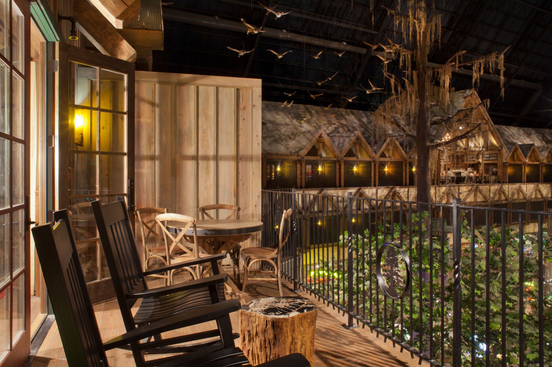 balcony inside big cypress overlooking the bass pro shops with ducks flying in the air